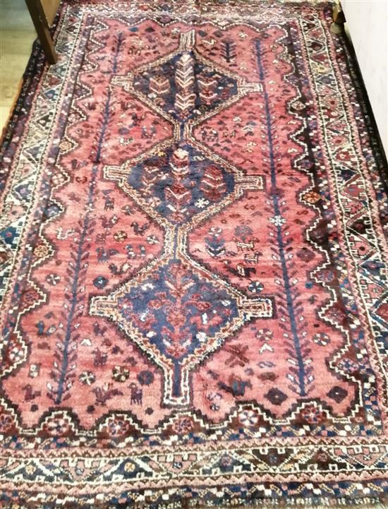 A Belouch red ground rug 240 x 156cm